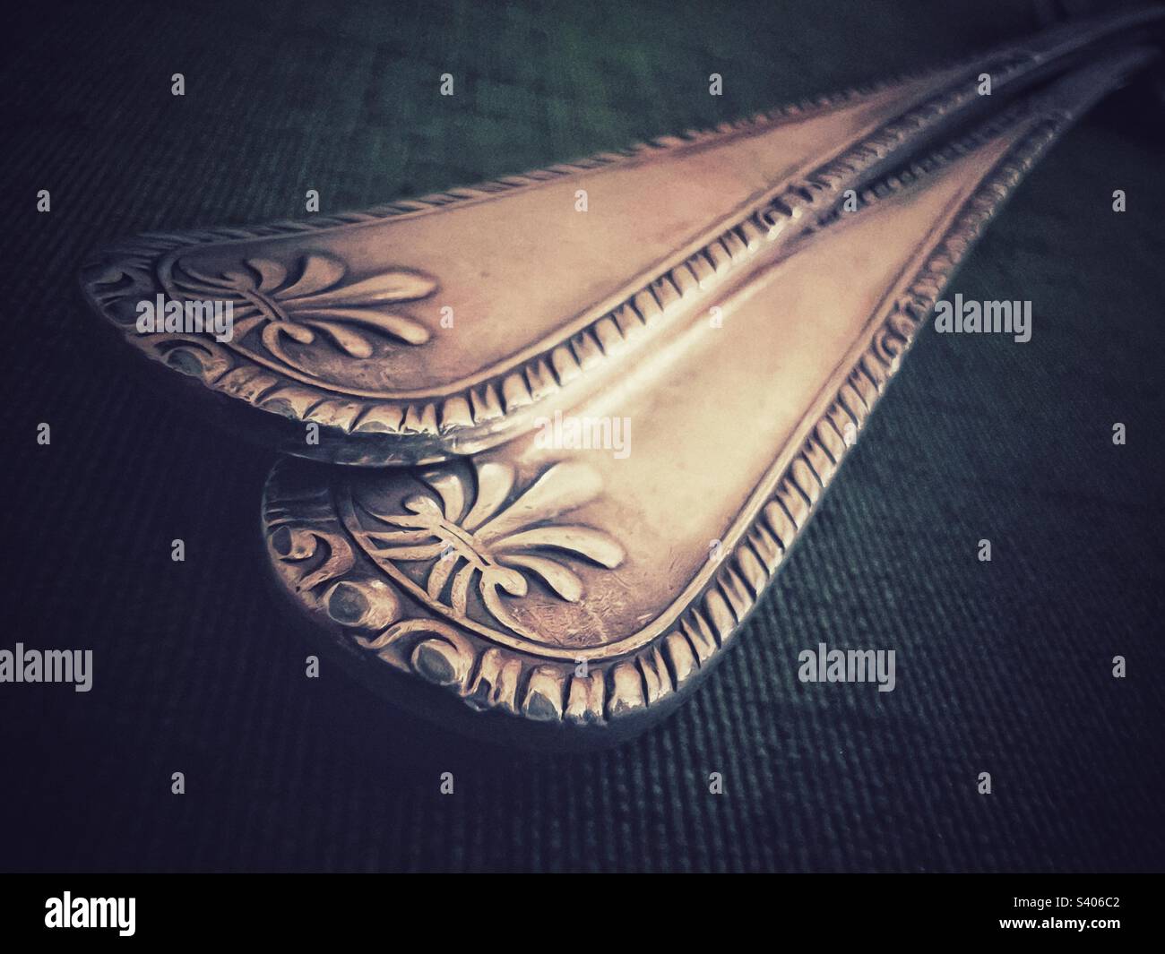 Closeup of motif on a silver spoon - Smartphone Captured Stock Image