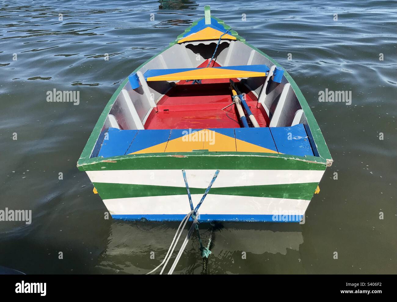 colorful fishing boat on the shore on a sunny day - Smartphone Captured Stock Image