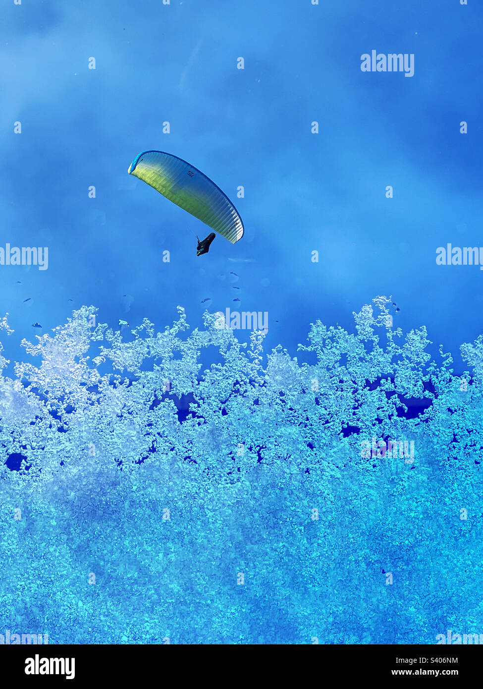 Paraglider above the snow line - Smartphone Captured Stock Image