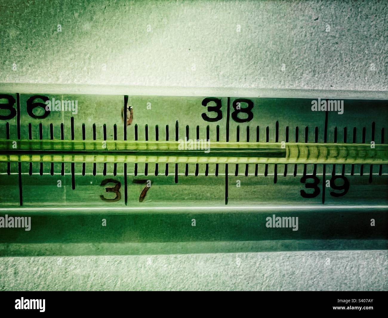 Detail of a thermometer showing high temperature 38,6 degrees celsius - Smartphone Captured Stock Image