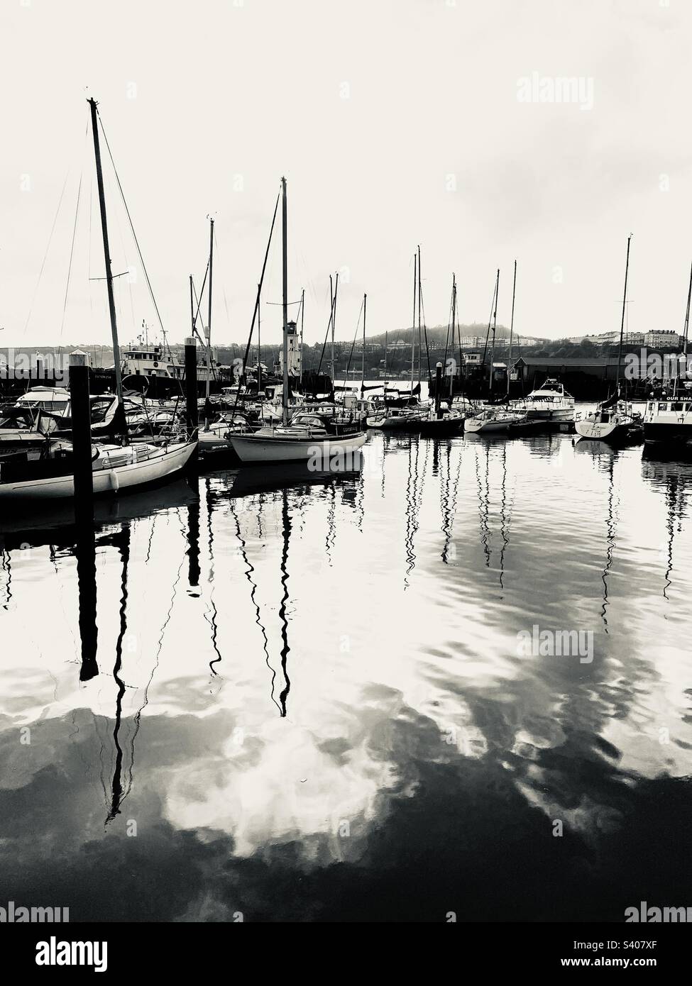 Black and white shot of boats moored in the marina in Scarborough, North Yorkshire - Smartphone Captured Stock Image