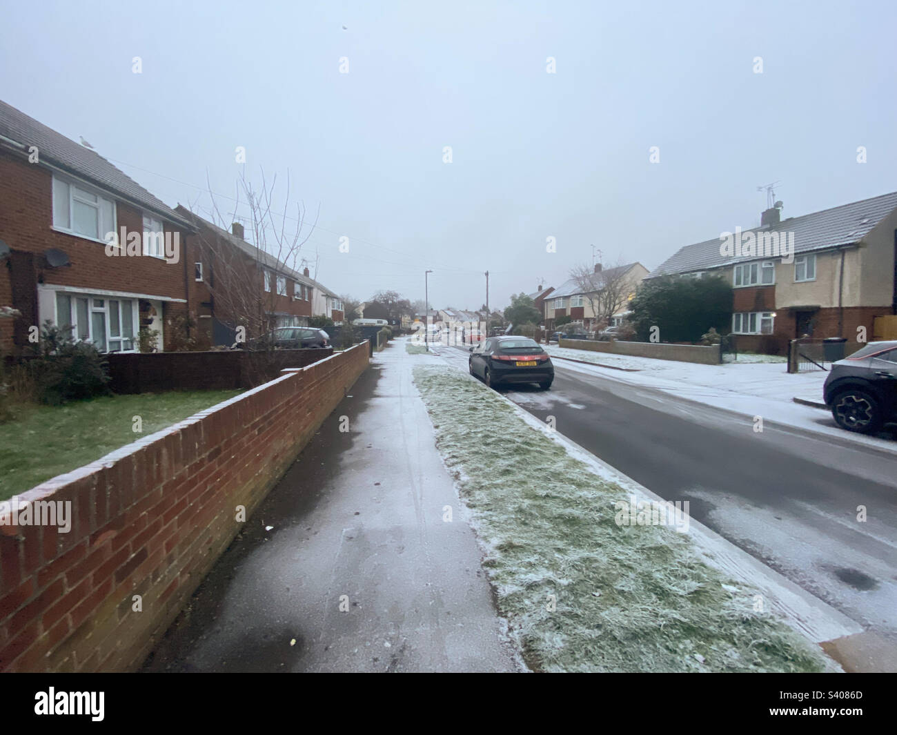 Snow on a street in Reading, UK on the 12th December 2022 - Smartphone Captured Stock Image