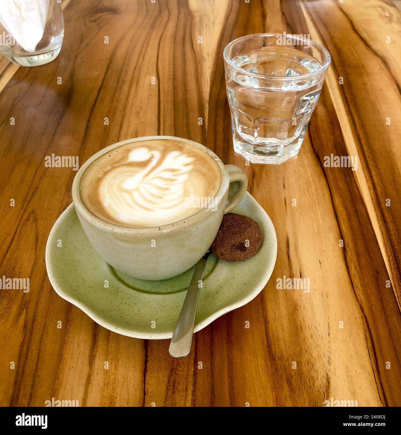 Premium Photo  Close up a glass cup of latte art coffee on wooden