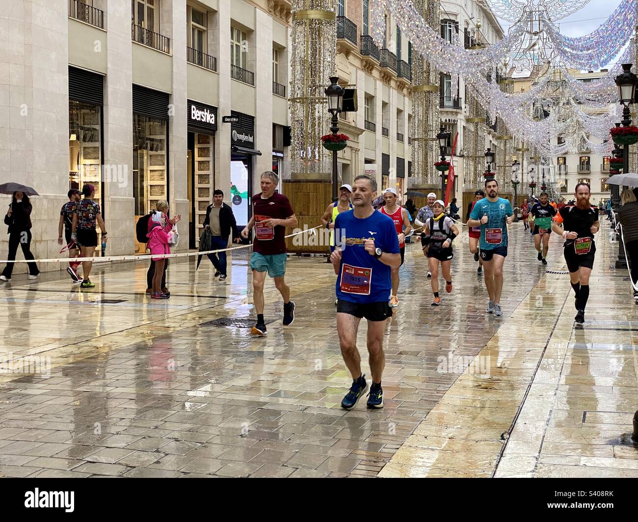 Runners in the Malaga Marathon which took place on 11 December 2022 - Smartphone Captured Stock Image