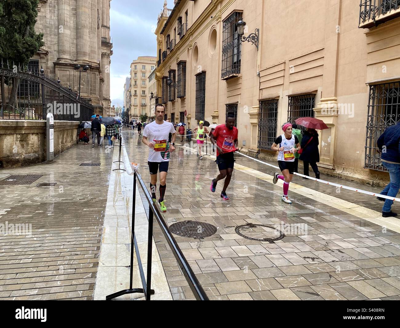 Runners taking part in the marathon in Malaga on 11 December 2022 - Smartphone Captured Stock Image