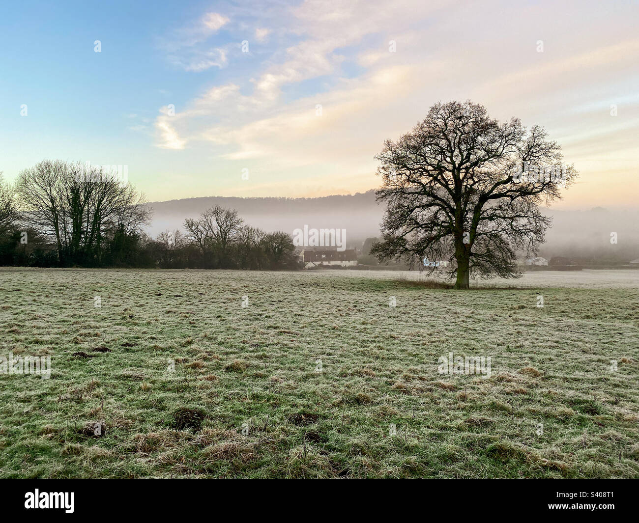 Mist lies in the valley on a crisp winter morning in rural Gloucestershire, UK. A mobile phone photo with some phone or tablet post processing. - Smartphone Captured Stock Image