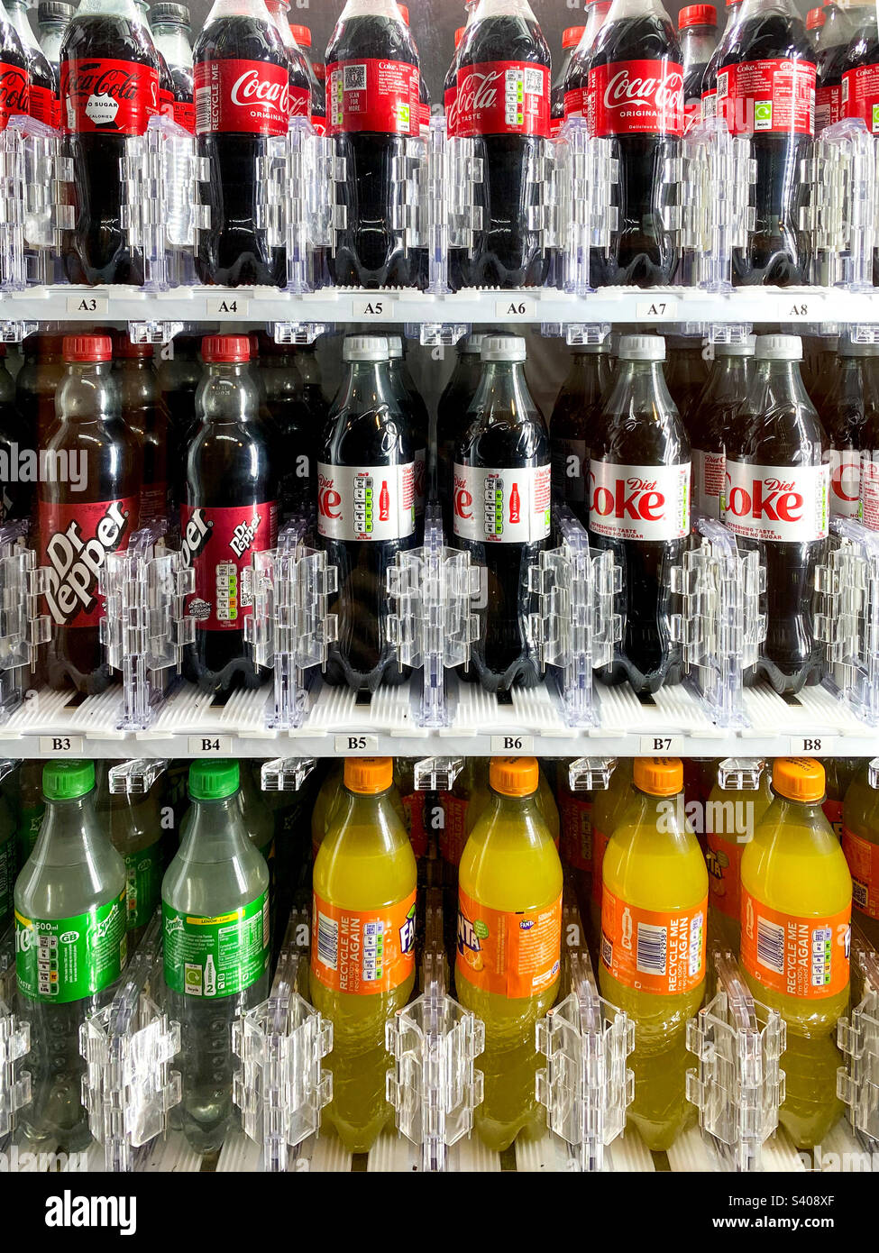 Bottles of fizzy drinks in a vending machine Stock Photo Alamy