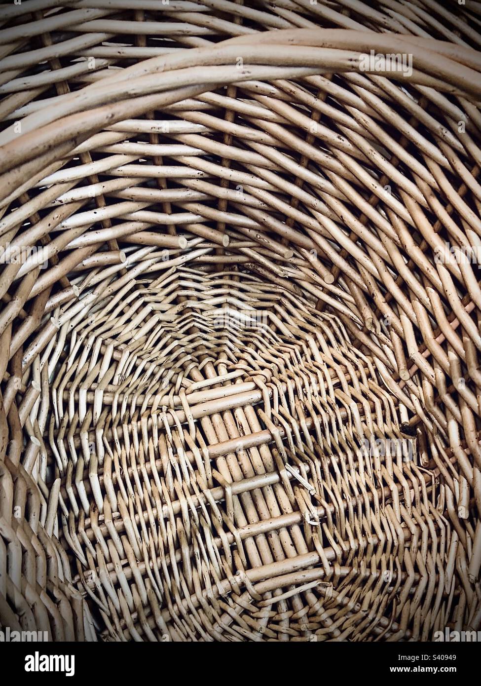 The inside of an empty wicker basket with handle Stock Photo Alamy