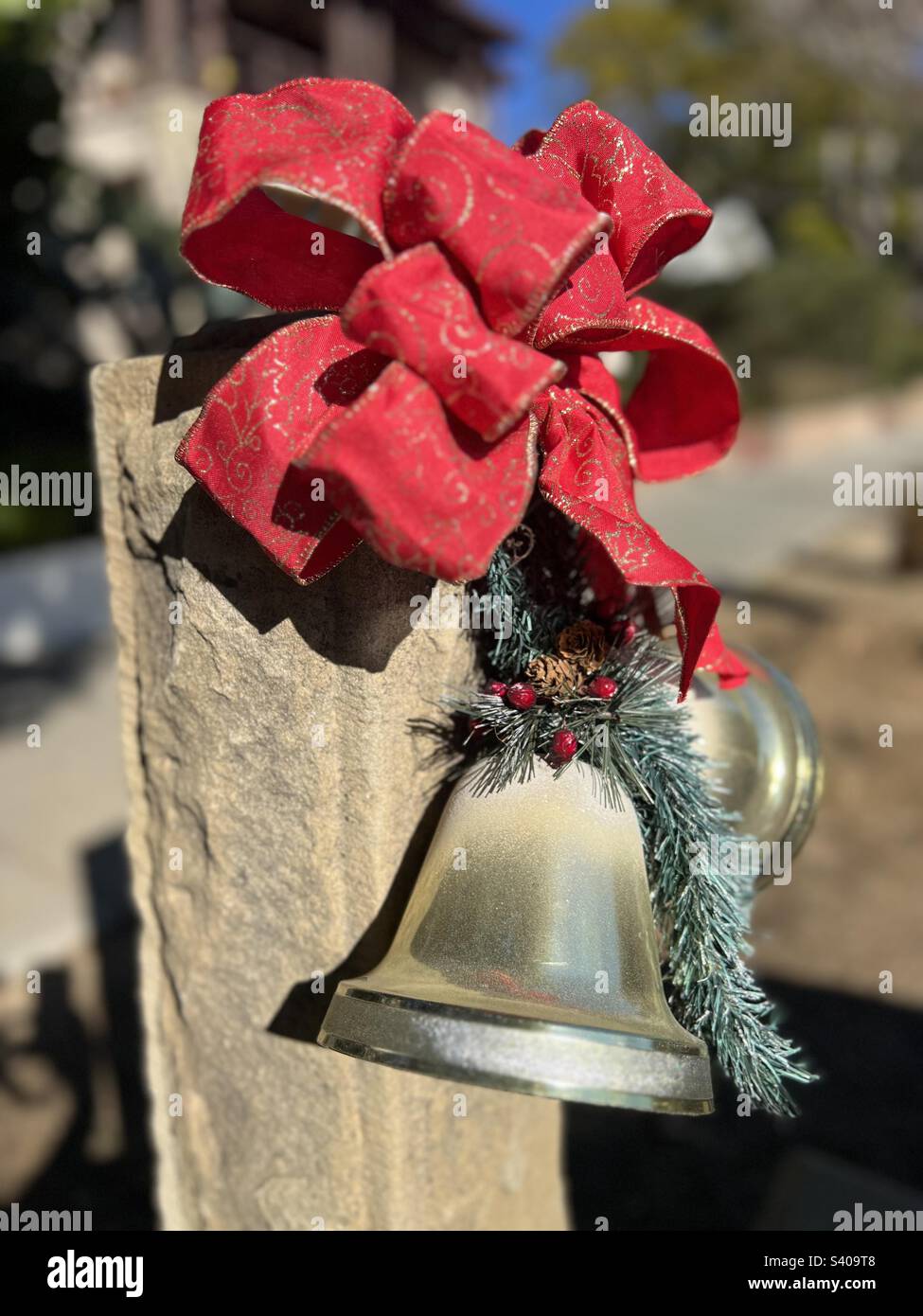 Christmas decorations on historical old hitching post in Santa Barbara, California Stock Photo