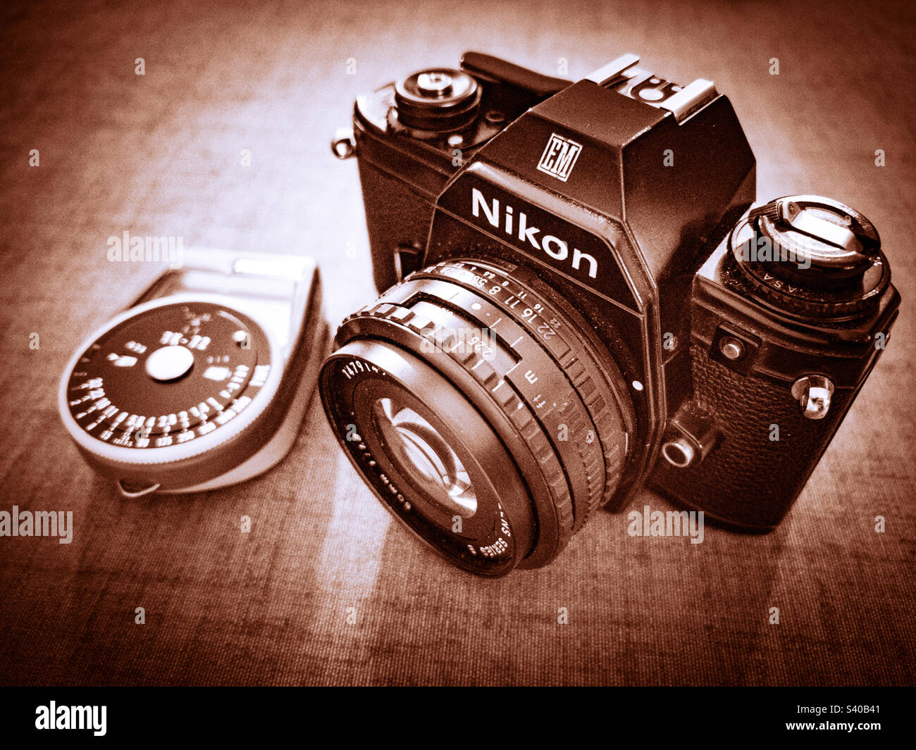 Vintage Nikon EM SLR analogue film camera and light meter Stock Photo