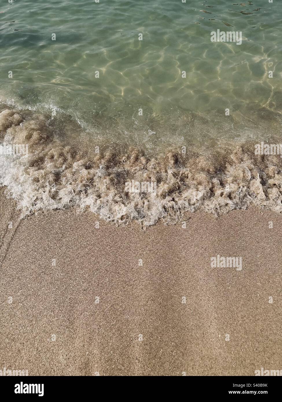 Mild waves and sand - Smartphone Captured Stock Image