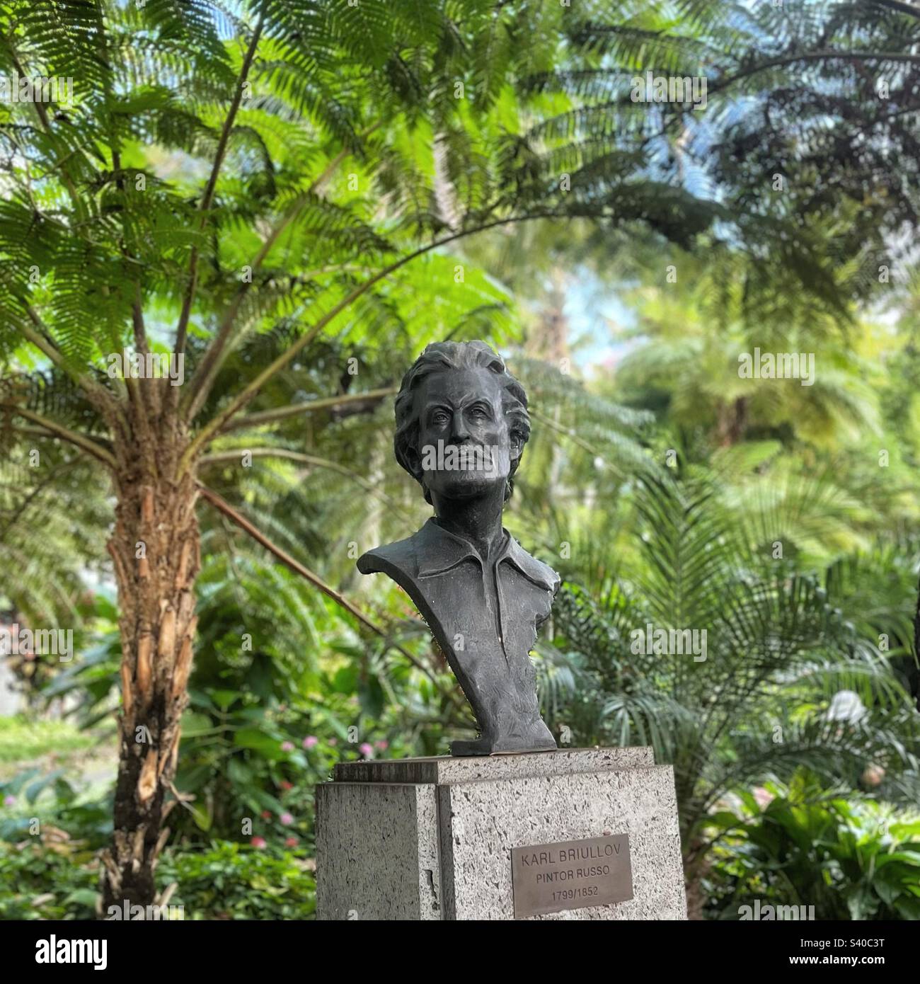 Russian painter Karl Pavlovich Bryullov spent time on Madeira This sculpture by local artist Luis Paixão is in the Jardim Municipal since 2013 surrounded by ferns plaque says: ‘Karl Briullov’ Stock Photo