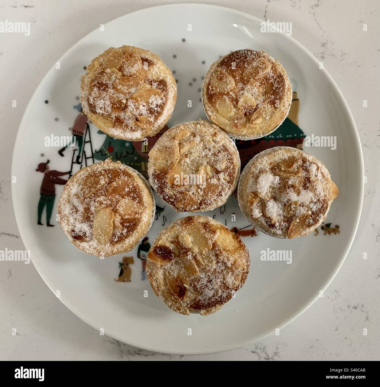 Frangipani mince pies on a festive plate - Smartphone Captured Stock Image