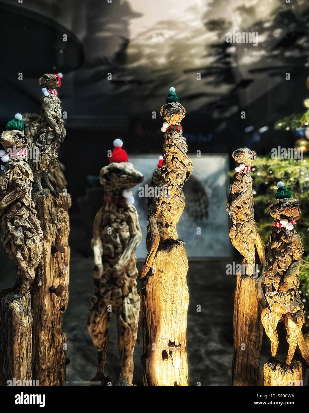Meerkats shop display artwork at Christmas decorations in London Knightsbridge - Smartphone Captured Stock Image