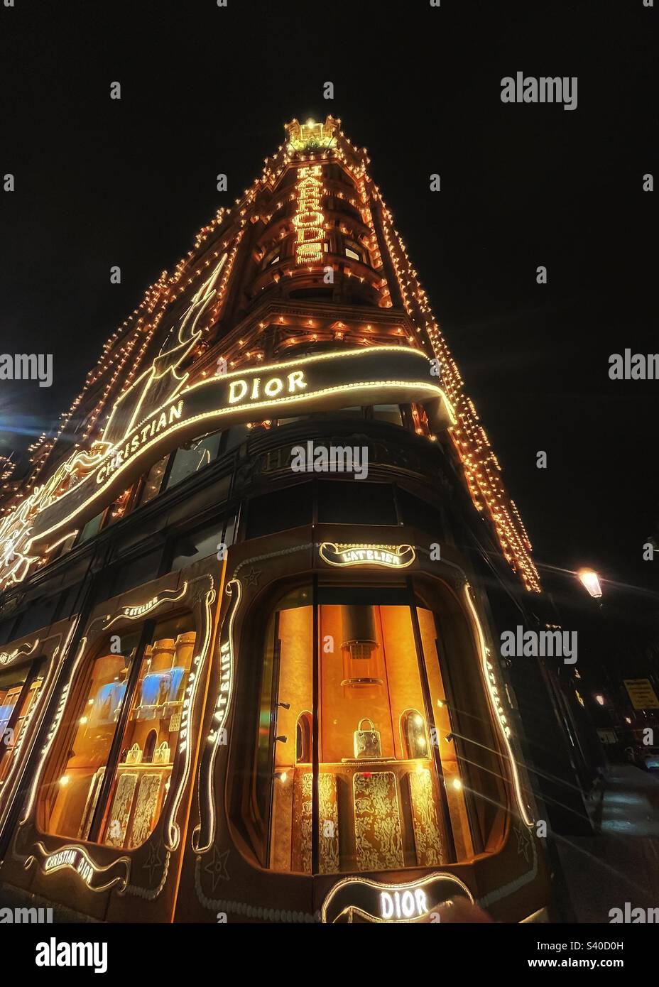 Harrods department store lit up for Christmas in Knightsbridge, London - Smartphone Captured Stock Image