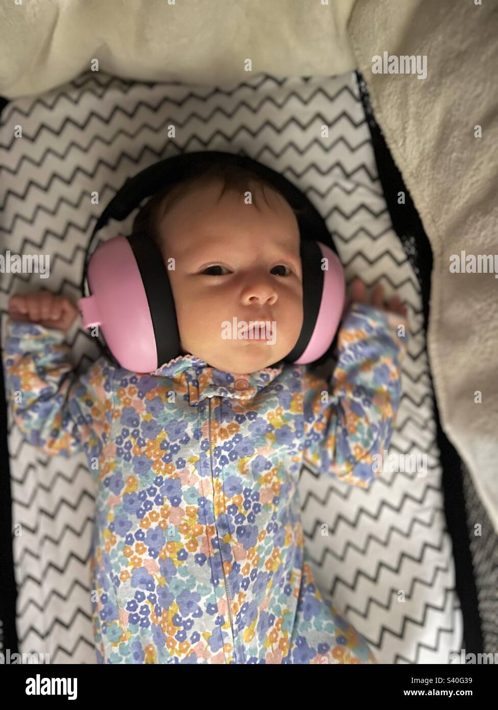 Newborn with headphone earmuff Stock Photo Alamy