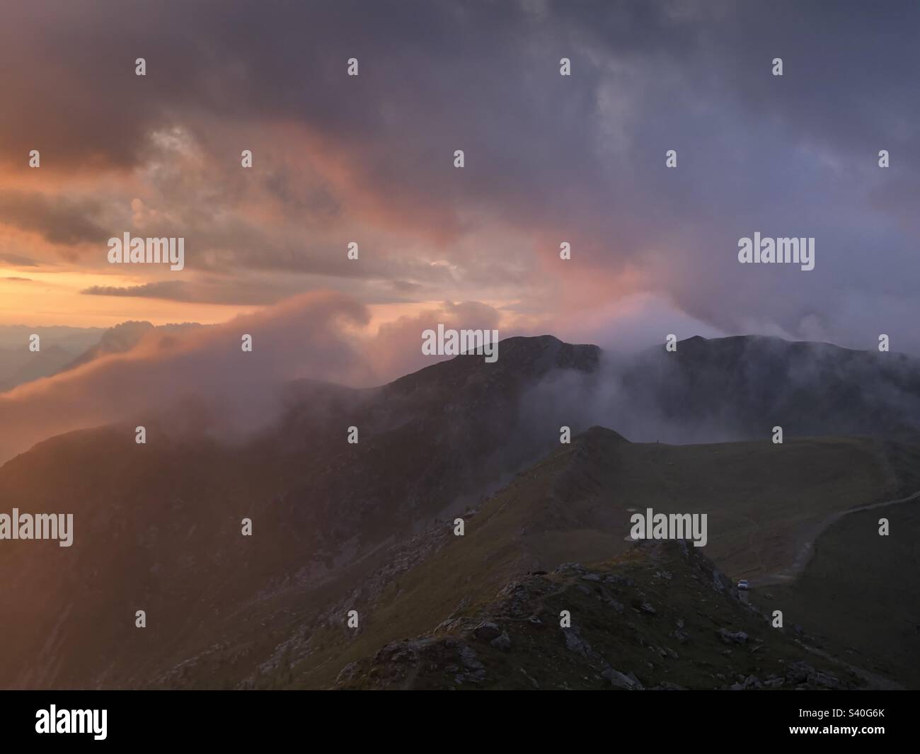 Foggy morning on top a mountain in the Tirolian Alps Stock Photo - Alamy