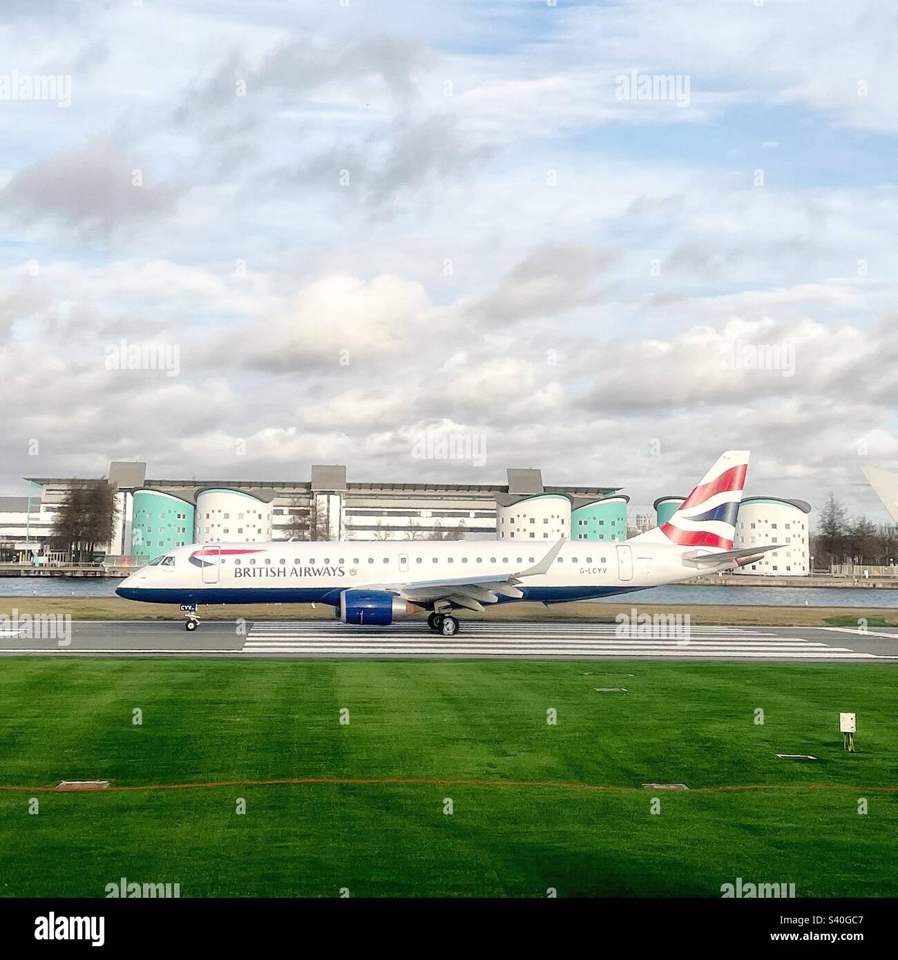 British Airways Embraer 190 on the runway at London City Airport Stock