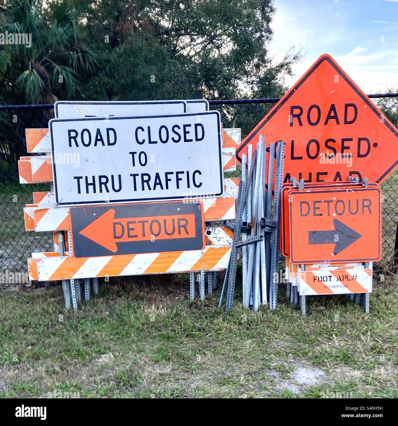 Road signs piled on side of road before closing - Smartphone Captured Stock Image