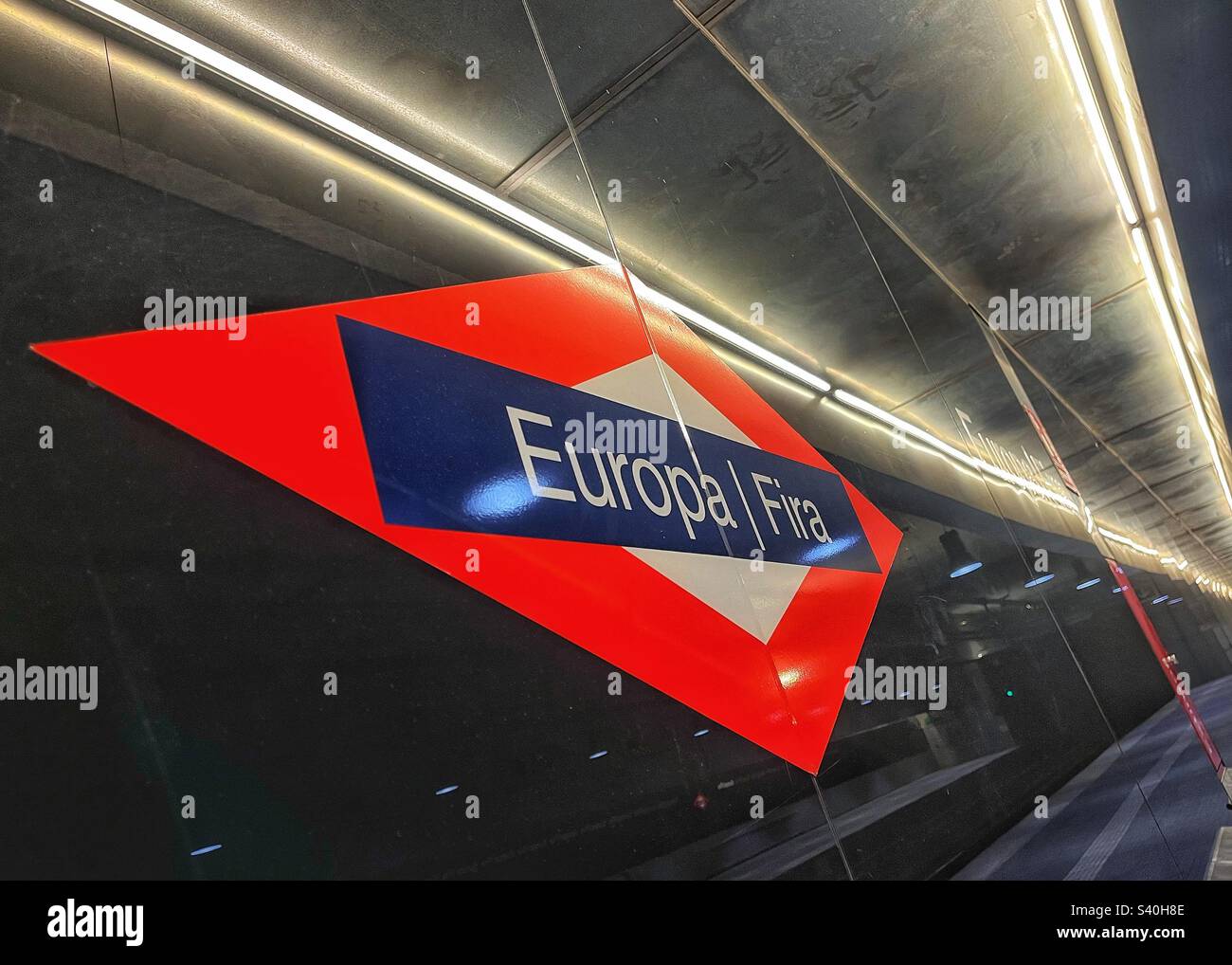 Europa Fira metro station livery graphics design on the station platform in Barcelona Spain - Smartphone Captured Stock Image