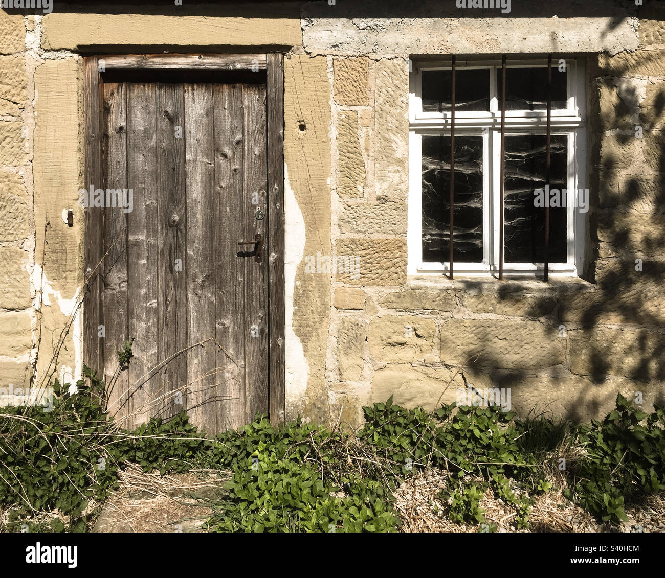 Old weathered wooden door with window - Smartphone Captured Stock Image