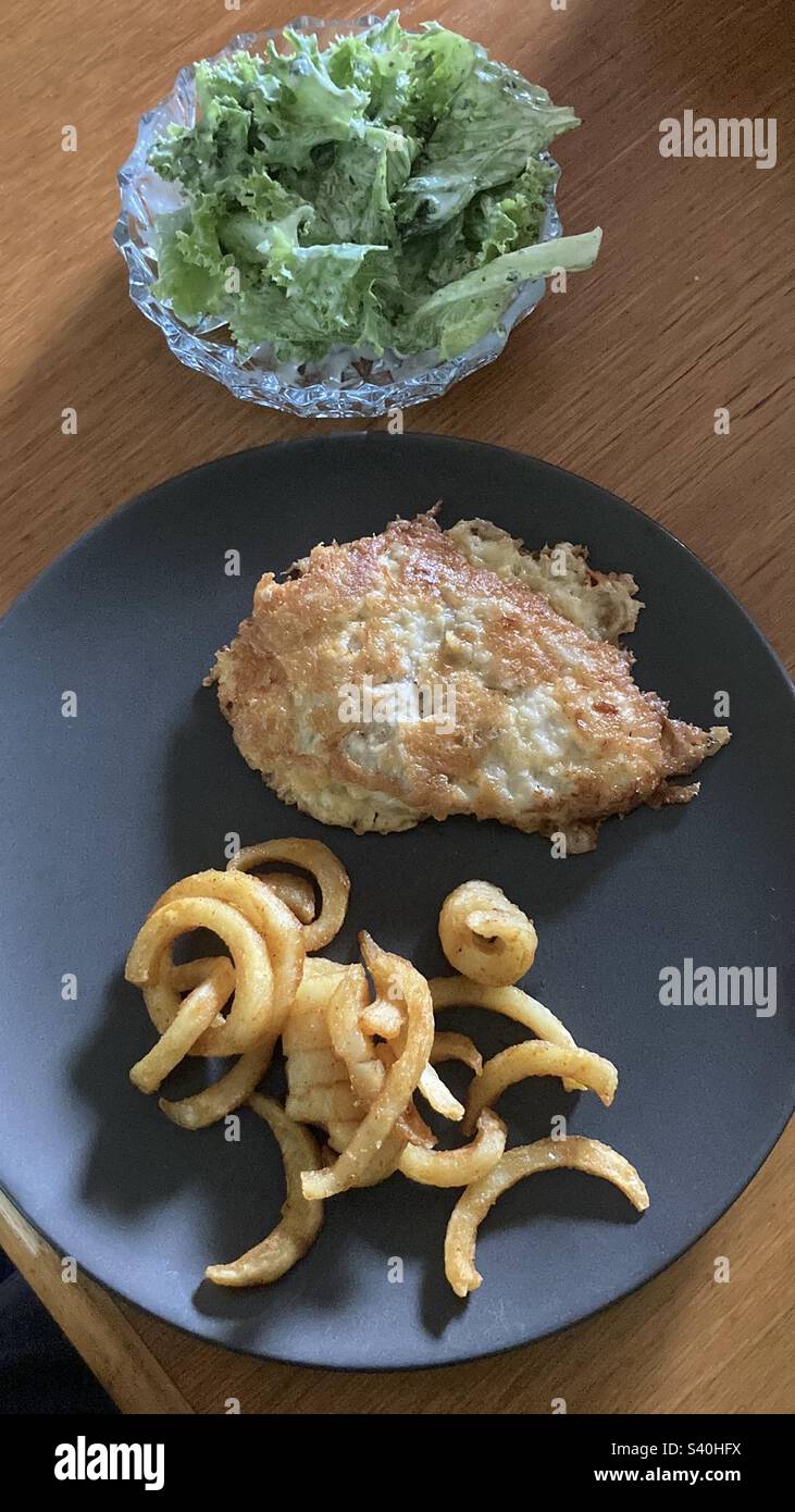 Delicious lunch, with meat and french chips Stock Photo