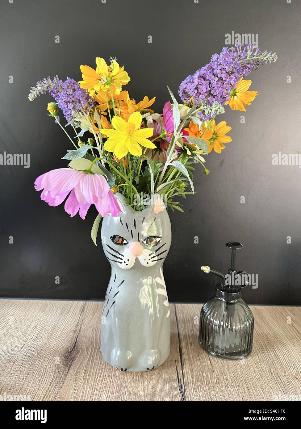 Flowers in cat vase Stock Photo
