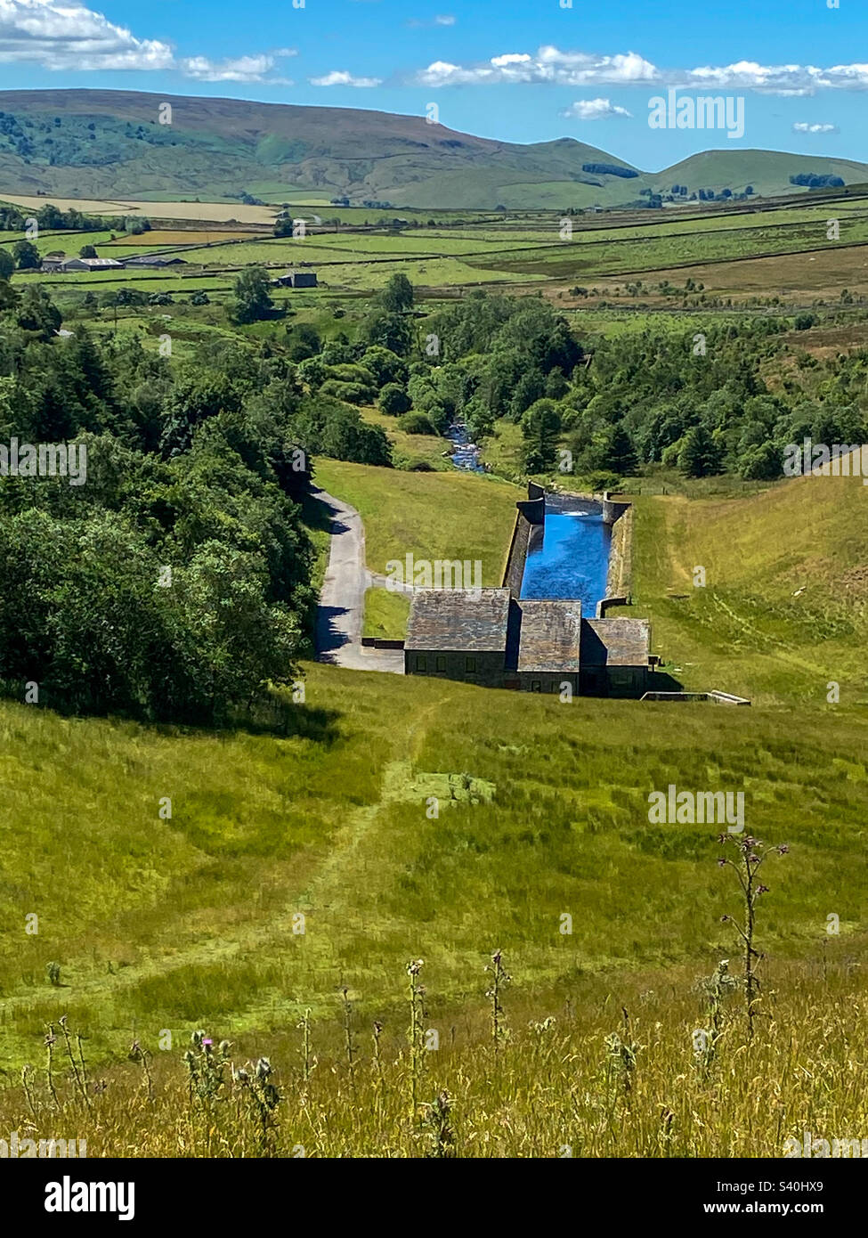 View over the Yorkshire Dales and the dam outflow of Grimwith Reservoir, Yorkshire, UK. A mobile phone photo with some phone or tablet post processing. - Smartphone Captured Stock Image