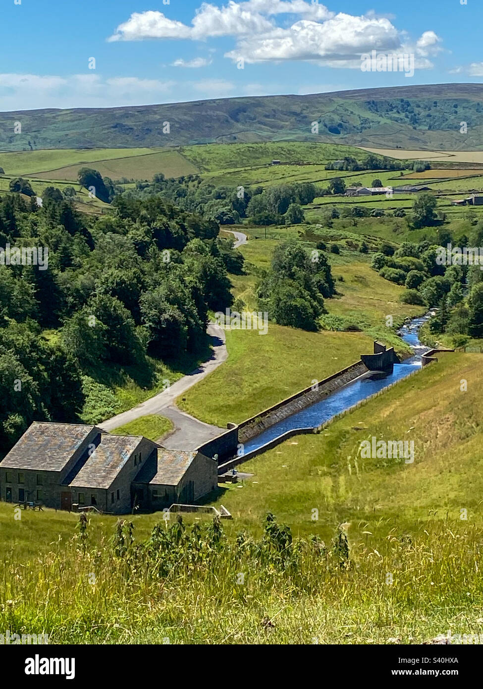 View over the Yorkshire Dales and the dam outflow of Grimwith Reservoir, Yorkshire, UK. A mobile phone photo with some phone or tablet post processing. - Smartphone Captured Stock Image