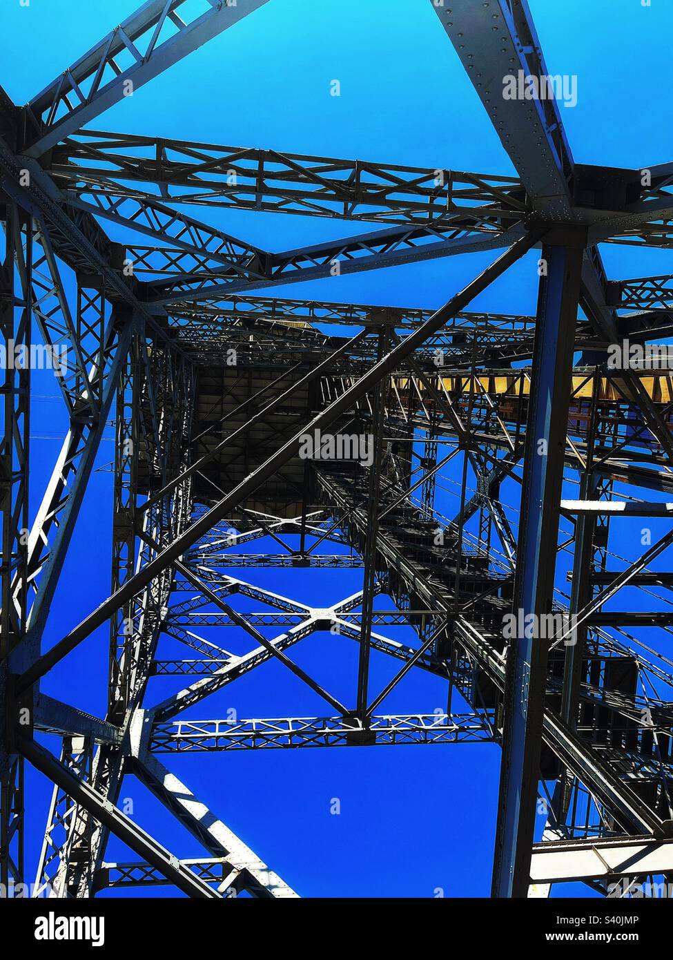 Port cable car in Barcelona designed 1929 - Teleferic del Port - this is Torre Sant Sebastia - looking underneath upwards - Smartphone Captured Stock Image