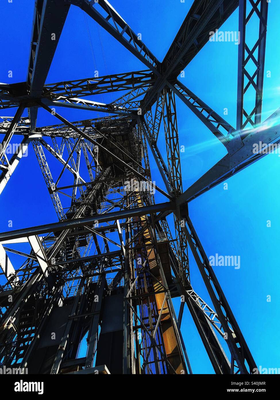 Port cable car in Barcelona designed 1929 - Teleferic del Port - this is Torre Sant Sebastia - looking underneath upwards Stock Photo