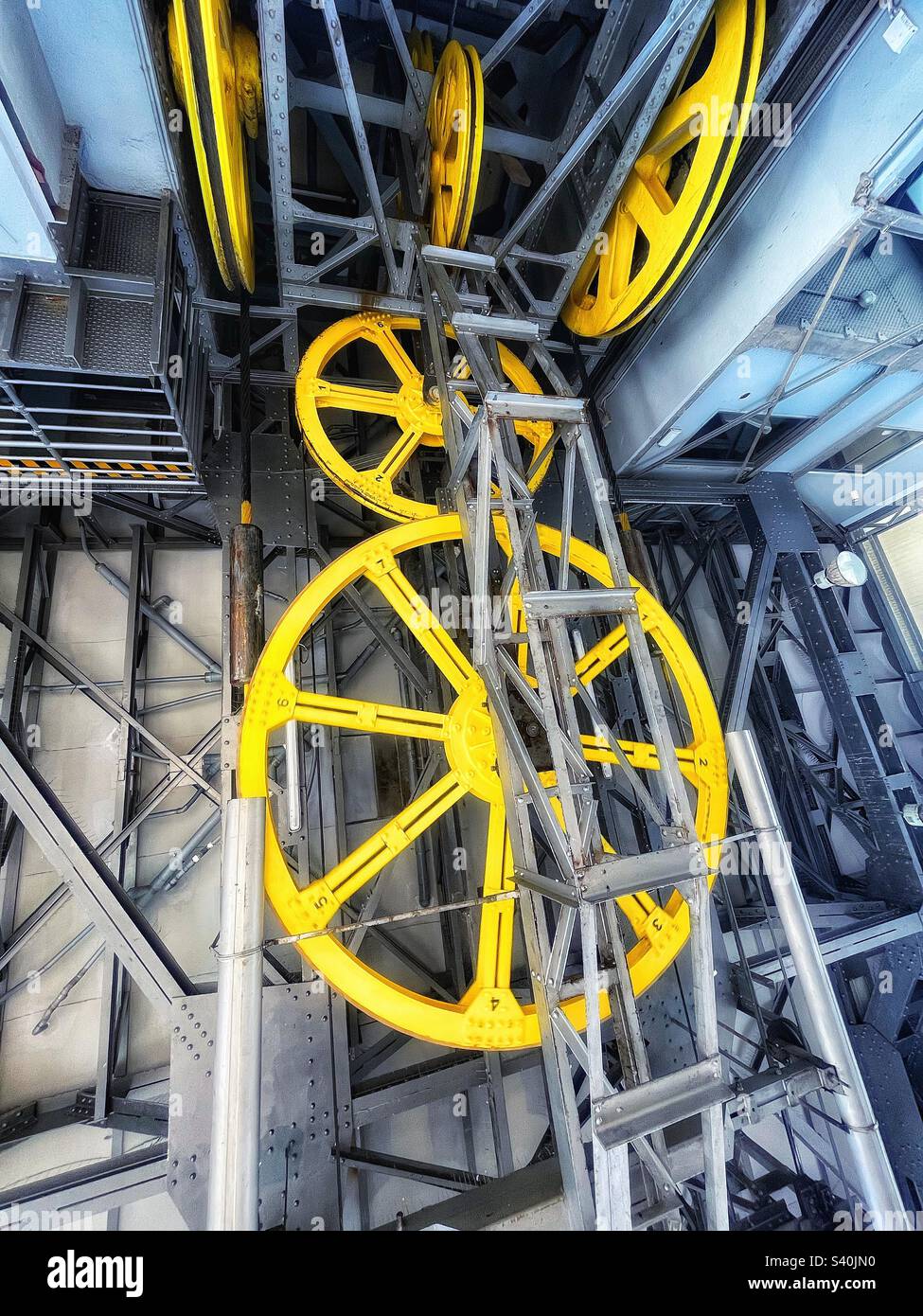 Inside the Port cable car tower in Barcelona designed 1929 - Teleferic del Port - this is Torre Sant Sebastia showing cogs and wheels - Smartphone Captured Stock Image