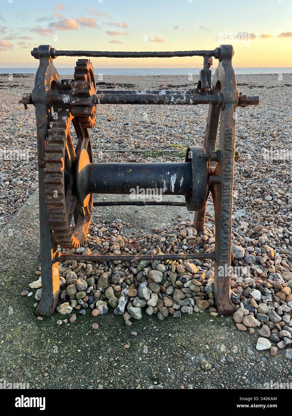 Old winch for pulling boats up the beach Stock Photo Alamy