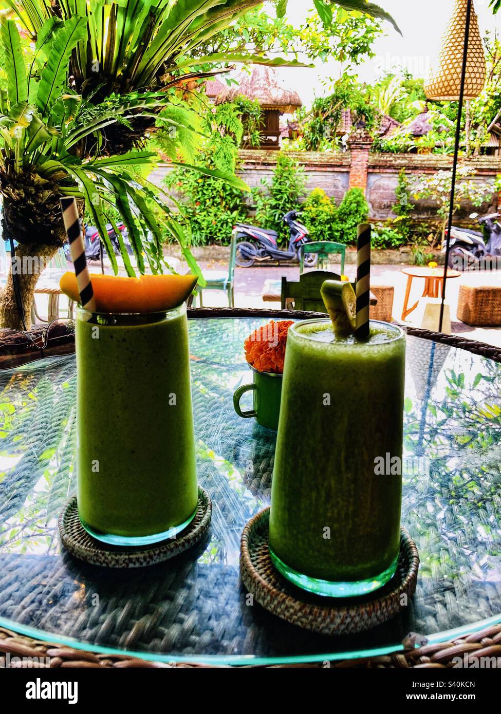 Two glasses of tropical green juice smoothies in Ubud Bali - Smartphone Captured Stock Image