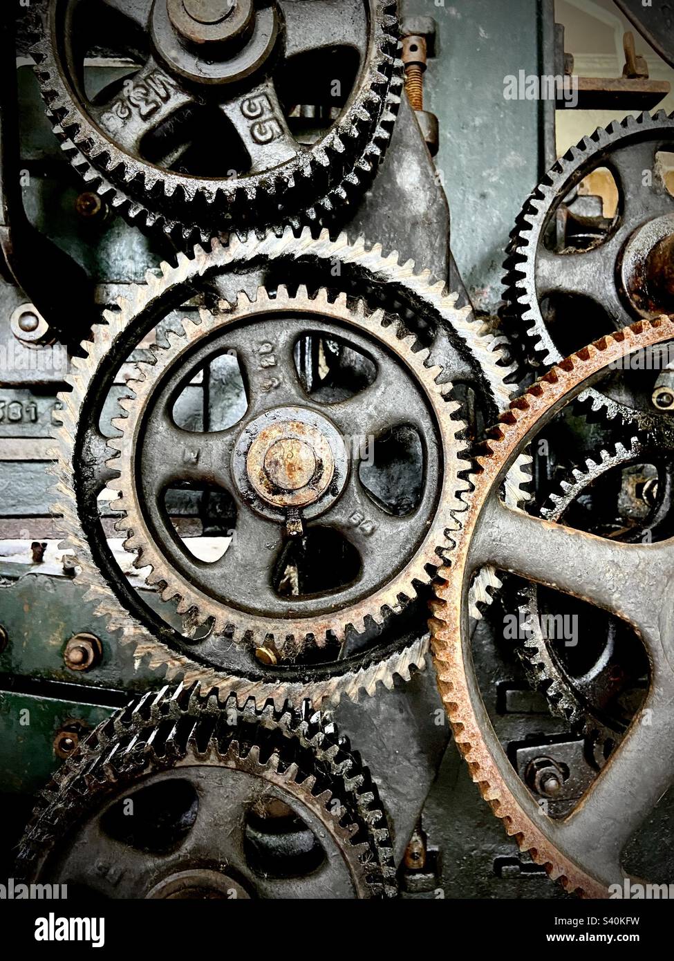 Photo of connected cogwheels on an industrial machine - Smartphone Captured Stock Image