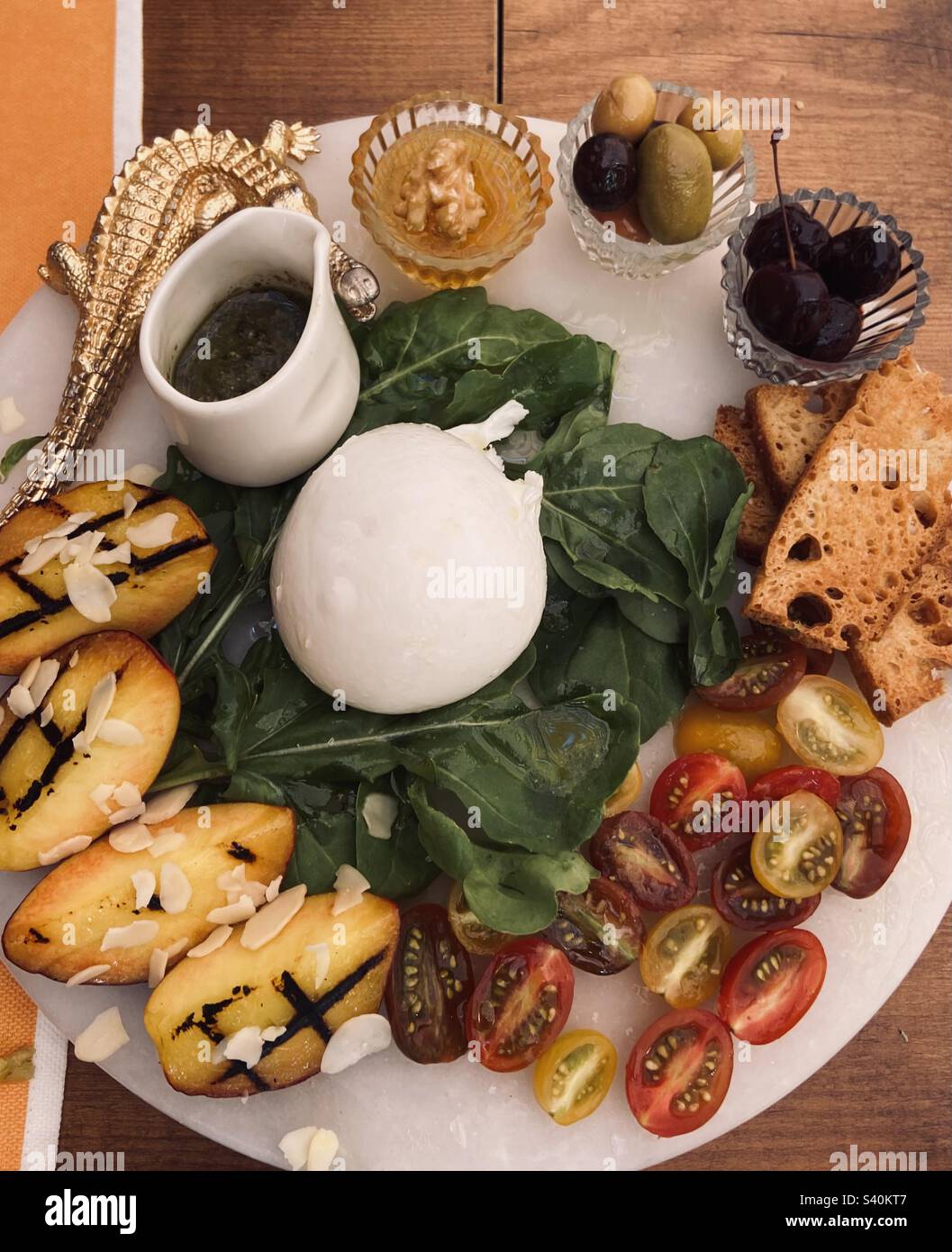 Burrata plate with tomato and peach - Smartphone Captured Stock Image