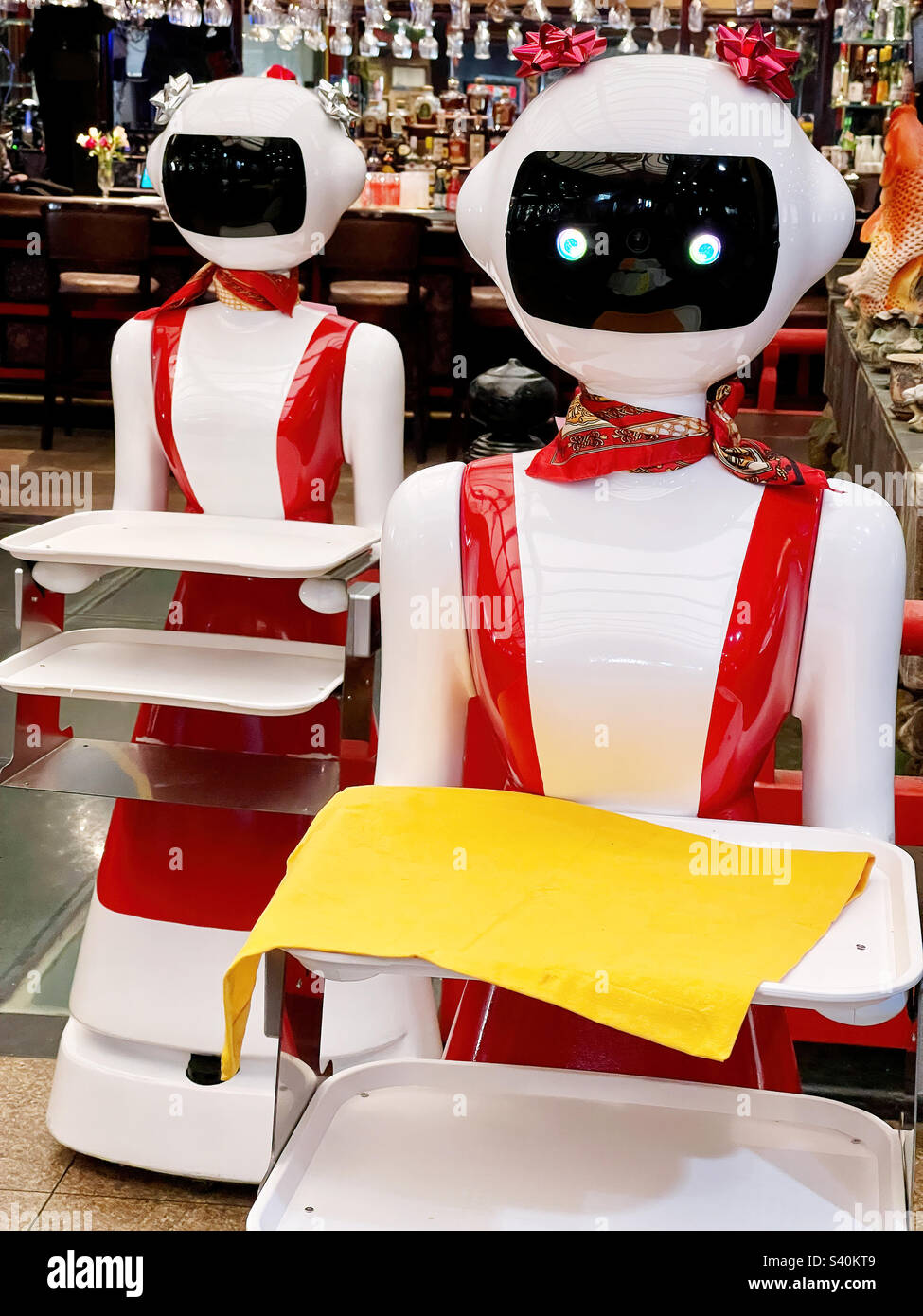 Two feminine robot servers in a restaurant Stock Photo Alamy