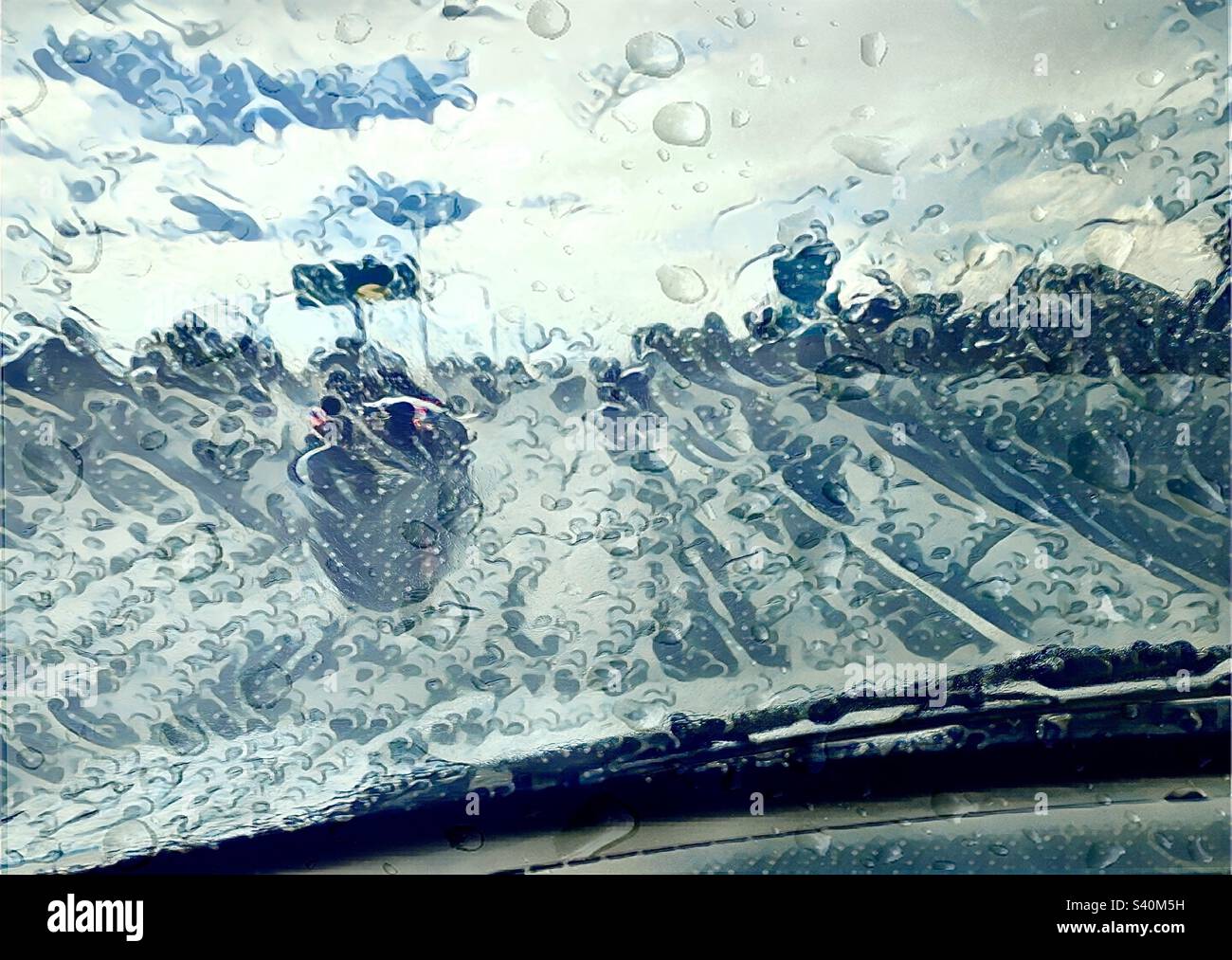 The Japanese art filter, Ukiyoe, was applied via the IOS app GoArt to this Utah image of a monsoonal rainstorm while driving down a local freeway. Splashes, raindrops and waves all combine and = Wet. - Smartphone Captured Stock Image