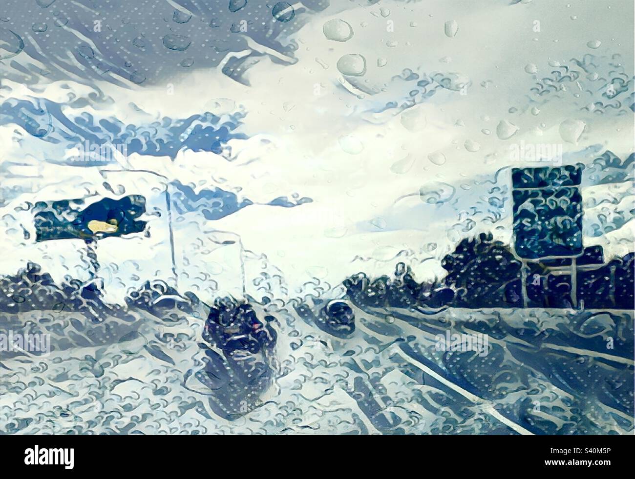The Japanese art filter, Ukiyoe, was applied via the IOS app GoArt to this Utah image of a monsoonal rainstorm while driving down a local freeway. Splashes, raindrops and waves all combine and = Wet. - Smartphone Captured Stock Image