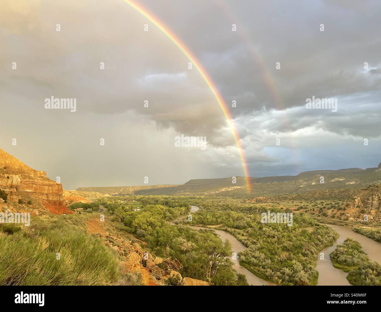 Double rainbow over Chama River in Abiquiu, Rio Arriba County, New Mexico. Stock Photo
