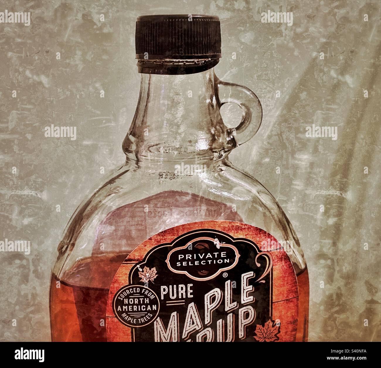 A bottle of pure maple syrup, sourced only from north American Maple trees. Good on so many things, or as an ingredient in cooking or baking. - Smartphone Captured Stock Image