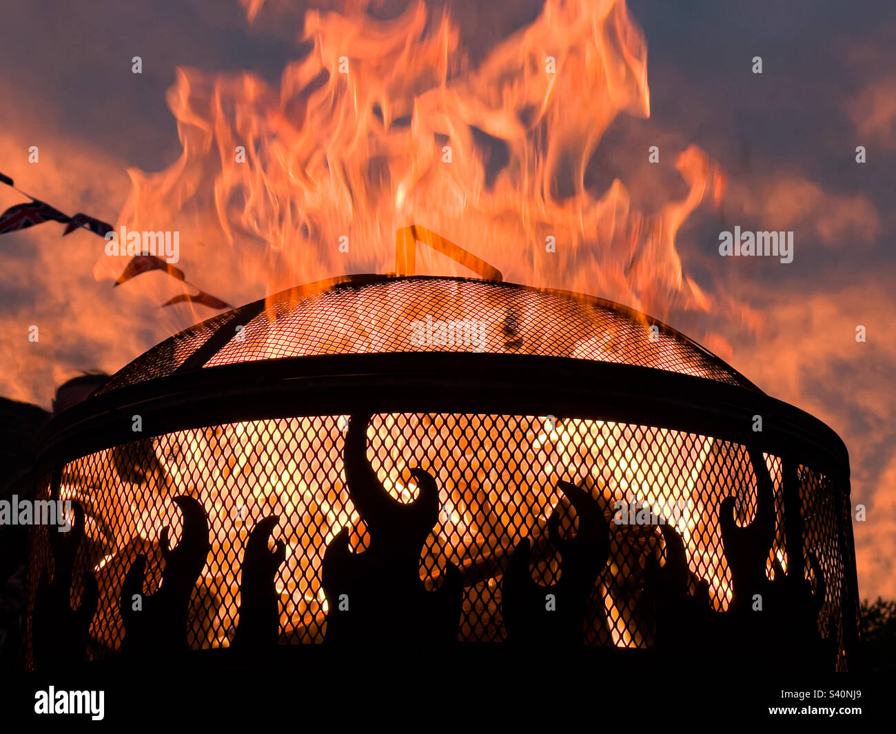 Flames from open chiminea firepit - Smartphone Captured Stock Image