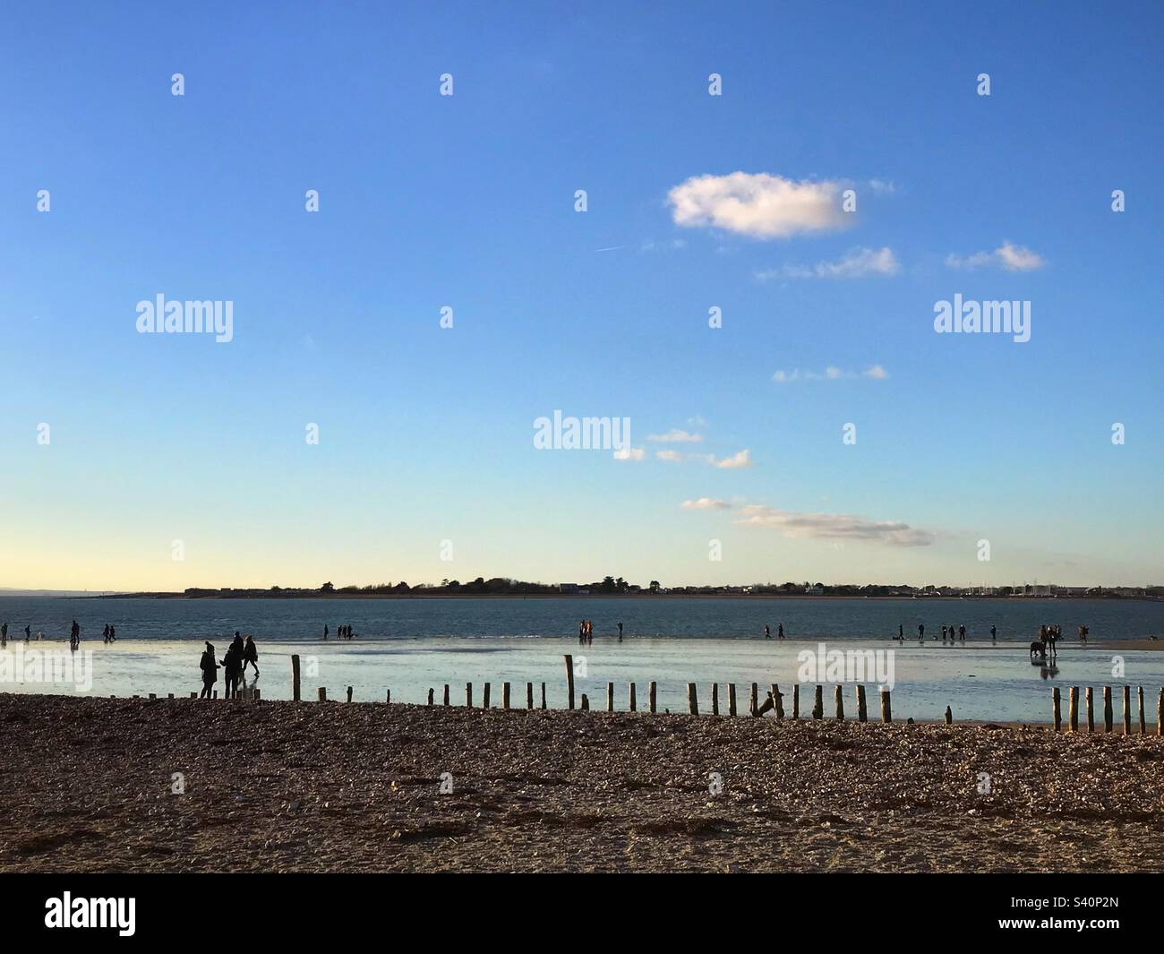 People taking a New Year walk on the beach at West Wittering, West Sussex, UK - Smartphone Captured Stock Image