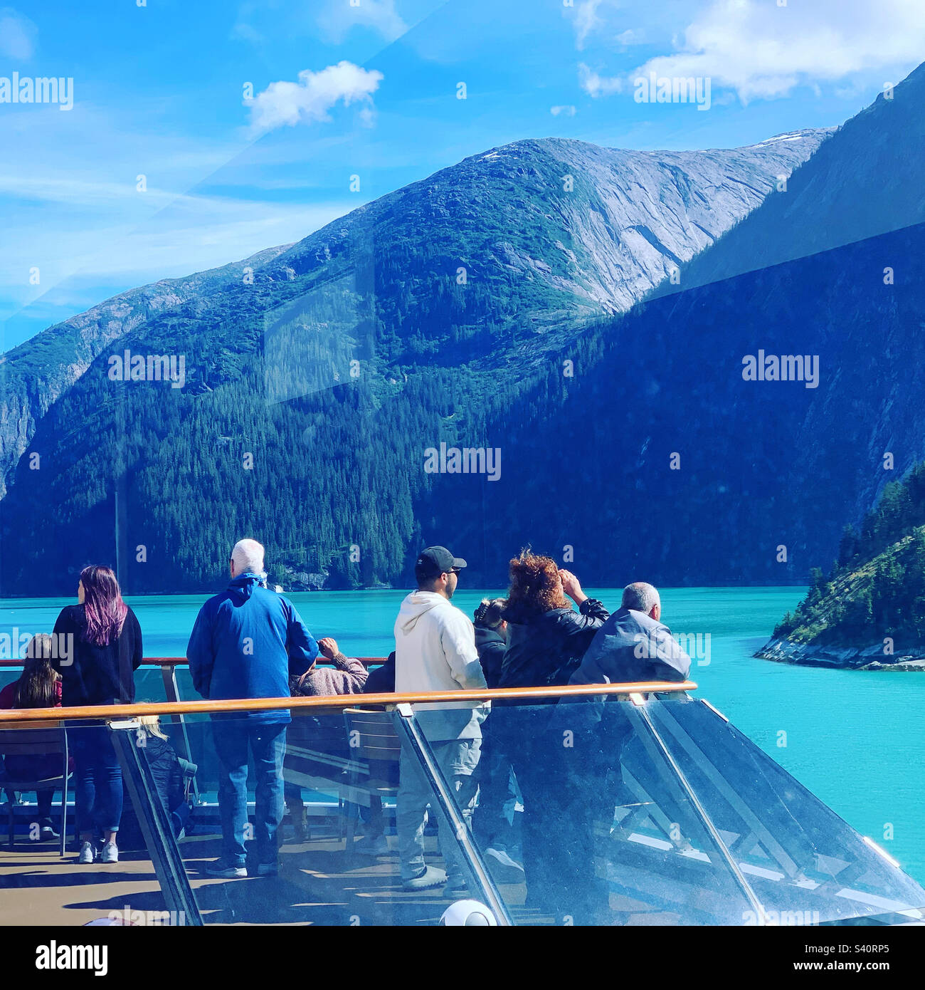 August, 2022, passengers taking in the view from Carnival Spirit cruise ship as it sails through Tracy Arm Fjord, Alaska, United States - Smartphone Captured Stock Image