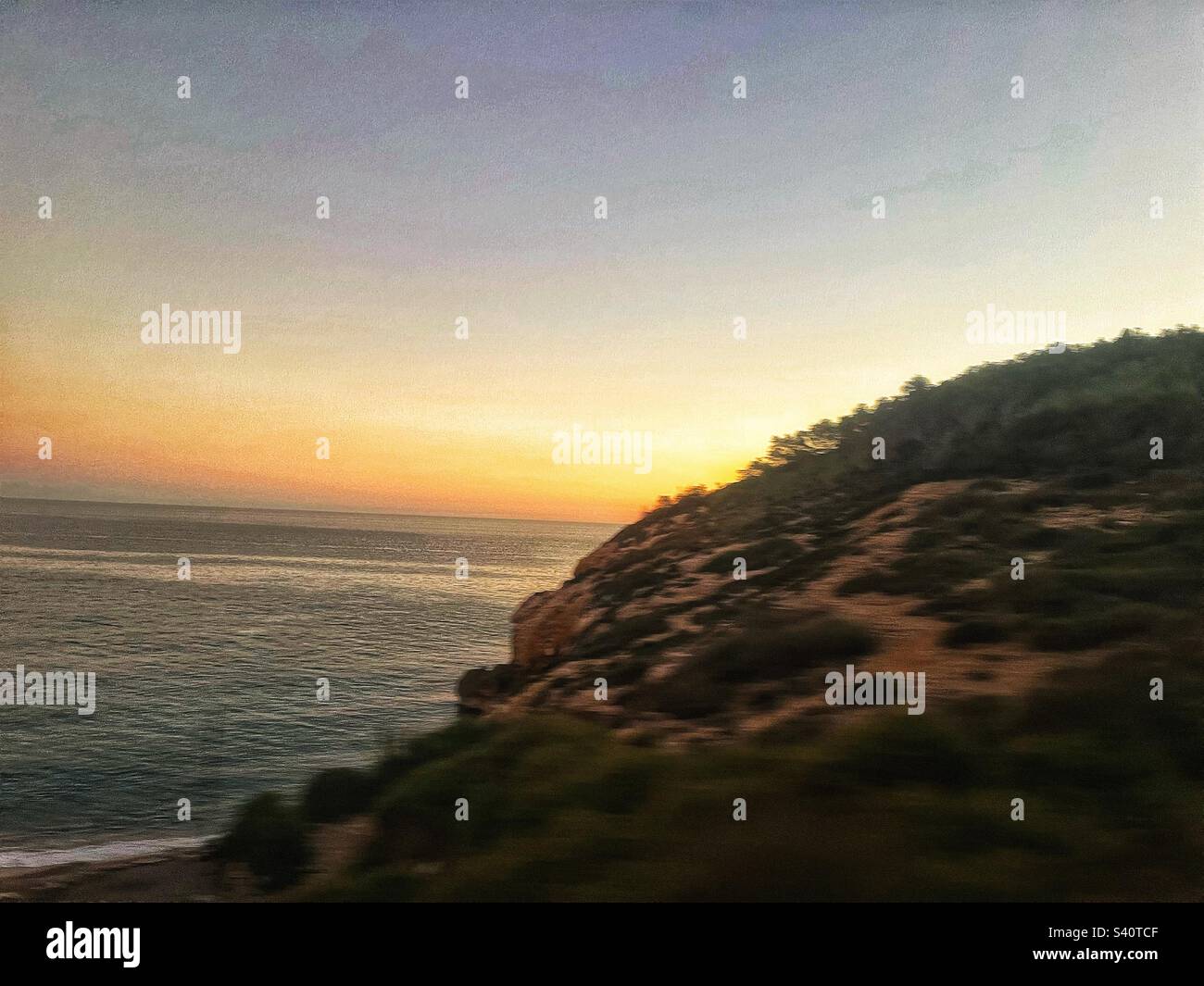 Sunset at the Spanish coastline at Playa del Muerta near Barcelona - Smartphone Captured Stock Image