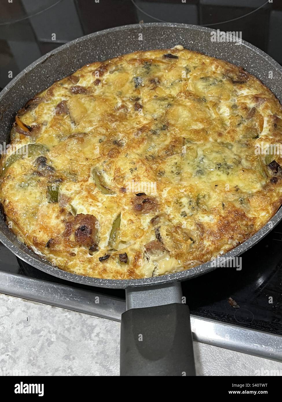 Pepper Omelette cooking in frying pan Stock Photo Alamy