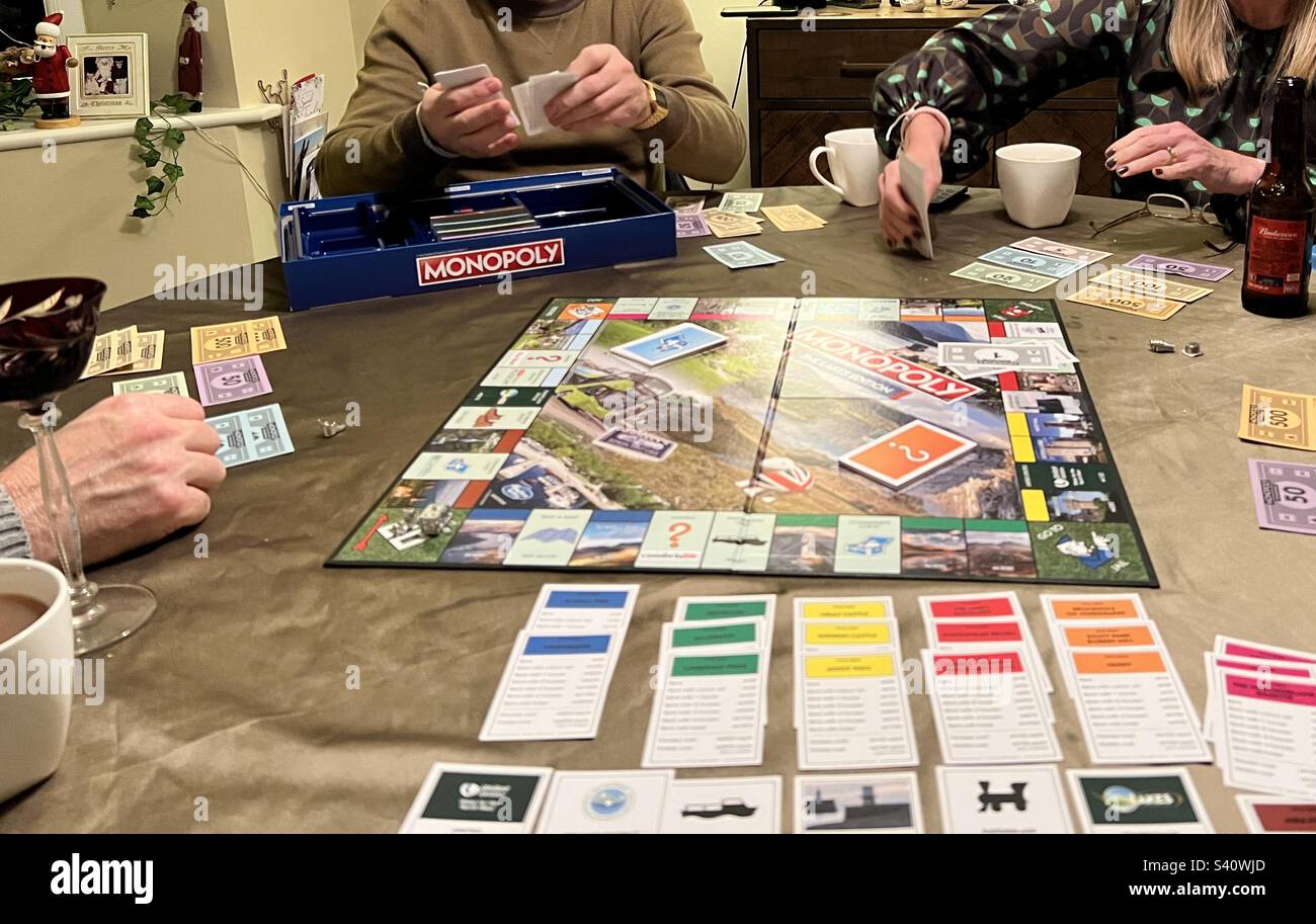 Family playing Monopoly Stock Photo
