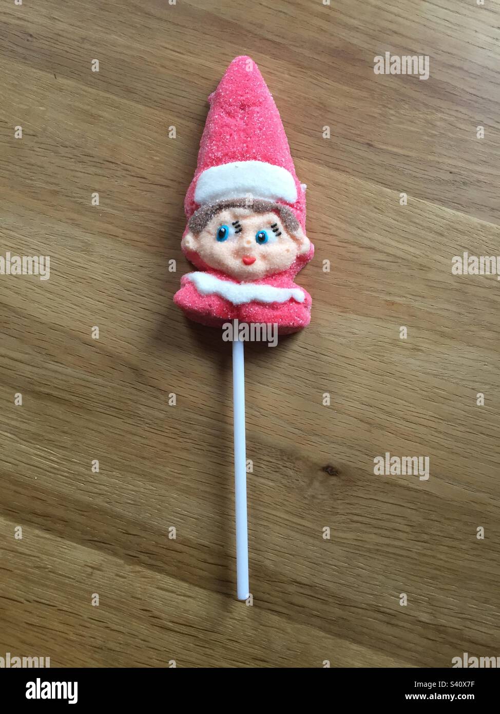 Candy Elf Lollipop brightly coloured and made with sugar Stock Photo