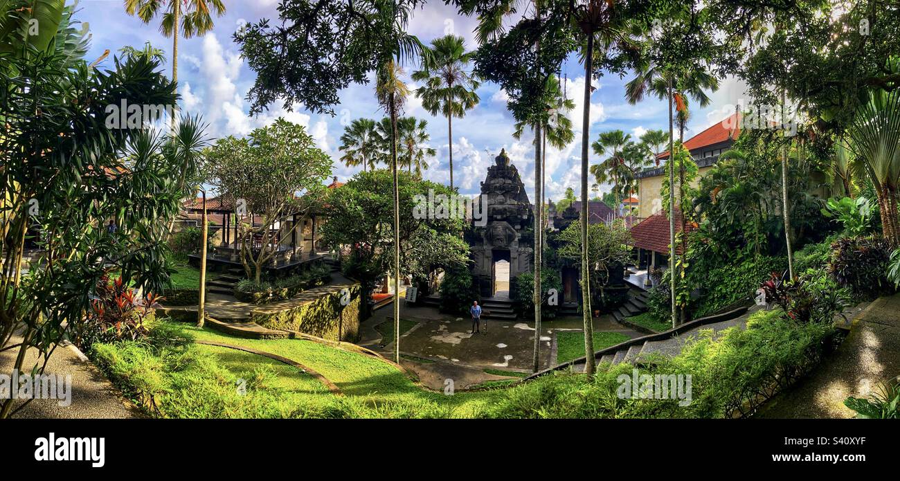 Panoramic of garden entrance in Ubud Bali with gateway and palms - Smartphone Captured Stock Image
