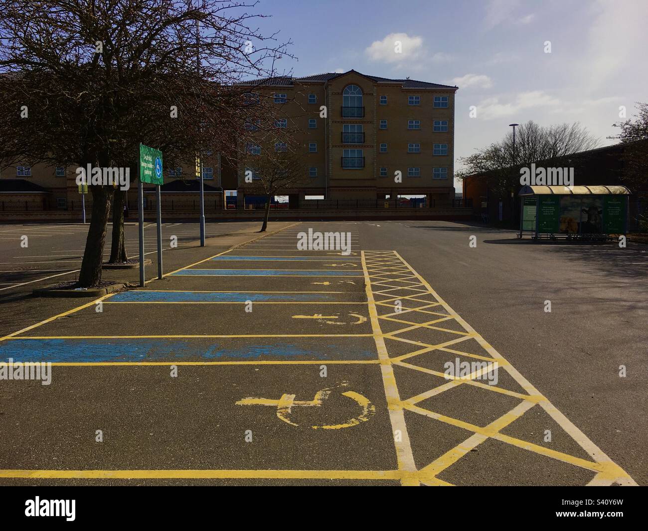 Disable parking in a car park, yellow lines mark,Norfolk,UK Stock Photo